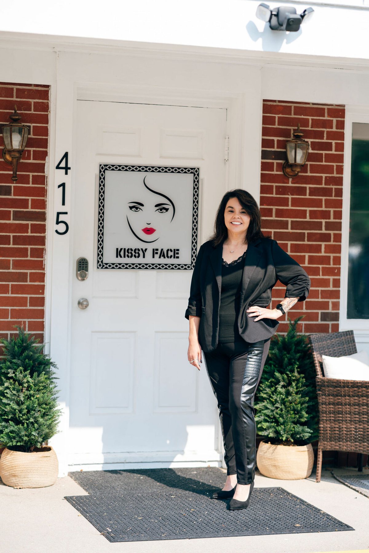 Kisstina Francis, founder and owner of Kissy Face Med Spa, outside the Adrian, Michigan studio